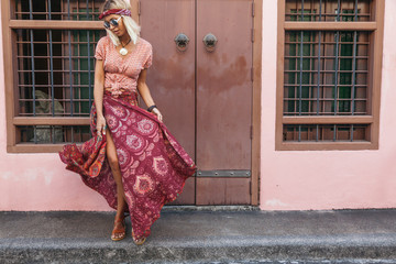 Boho girl walking on the city street