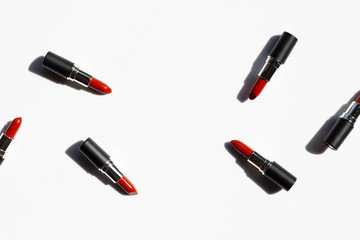 Flat lay composition, Lipsticks on white background with shadow. Beautiful Make-up concept