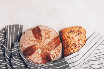Different kinds of bread on white backdround.