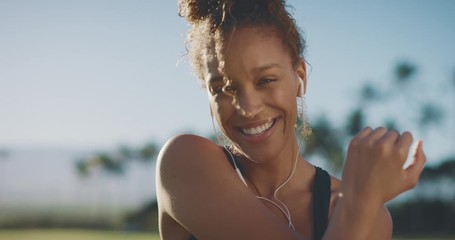 Portrait of a happy smiling african american woman getting ready for her morning workout, athletic african american woman living a healthy lifestyle - Powered by Adobe