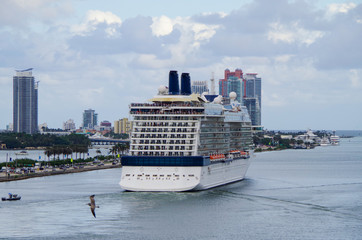 Luxury Celebrity Cruises cruise ship or cruiseship liner departs Port of Miami and sailing past...
