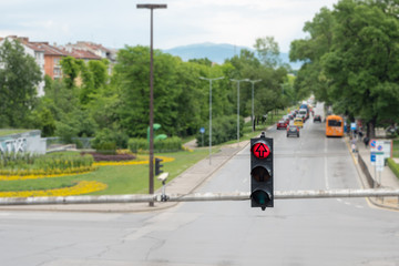 A traffic light over a large intersection with a red signal, Sofia, Bulgaria.