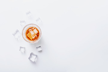 glass of whiskey with ice on a white background with place for text