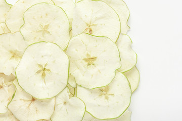 Healthy food concept. Apple chips on a light background.
