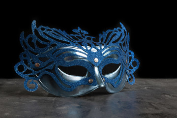 blue carnival mask on dark