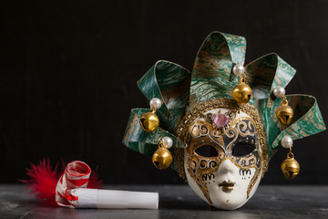 venetian carnival mask and matasuegras