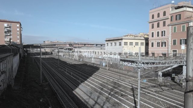 Empty railway tracks running along the Casilina street in Rome, Italy