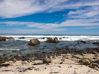 stone coast, blue water and beautiful sky