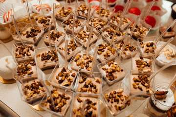  Wedding candy bar rich served, white cookies and chocolates and macaroons. Candy bar with balls, candy bar on holiday, candy bar at the wedding