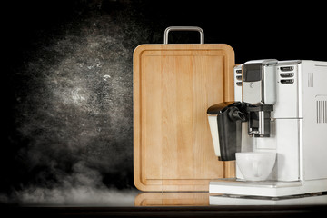 White coffee machine and black background space with smoke 