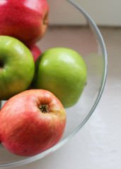 apples in a bowl  on a white background