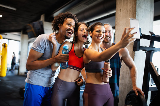 Friends making selfie in the gym after workout