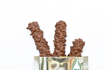 chocolate bar snack package aluminum foil on white background