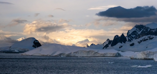 Sunset over the Stunning icy landscapes, Chiriguano Bay, Danko Island, Antarctic Peninsula,...