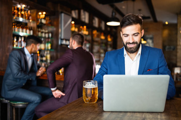 Young business man having a break in a restaurant. Work occupation business lifestyle concept