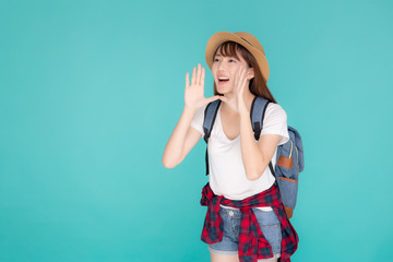 Beautiful young asian woman shouting sound loud with mouth for announce something in vacation travel with excited isolated on blue background, tourist asia girl journey in summer concept.