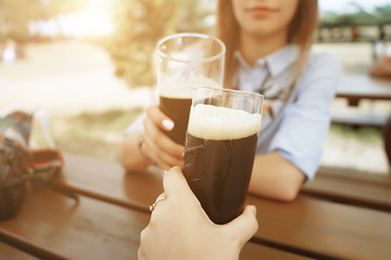Couple dark beer cheers