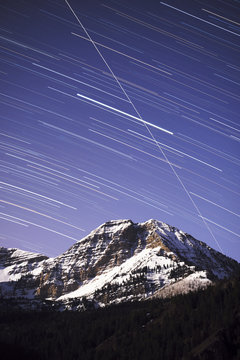 Star trails above Mt. Timpanogos with Space Station crossing sky - American Fork Canyon, Utah