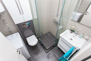 Interior of small modern bathroom with shower
