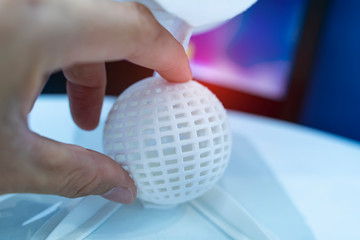 hand with Object printed on 3d printer close-up.