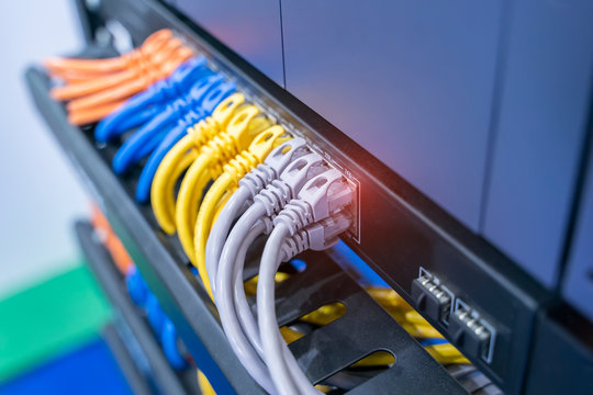 network cable connecting on network core switch close up