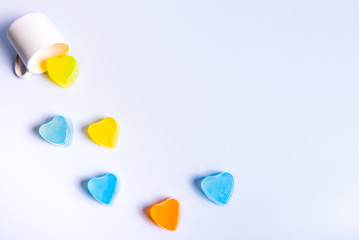 Small cake shaped in a coffee cup on a white background for valentines day.