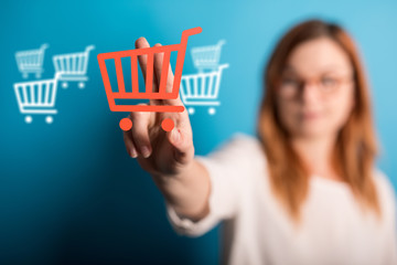 Businessman pressing modern technology panel shopping cart web phone credit card.