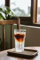 Ready tonic coffee with ice for the summer on table