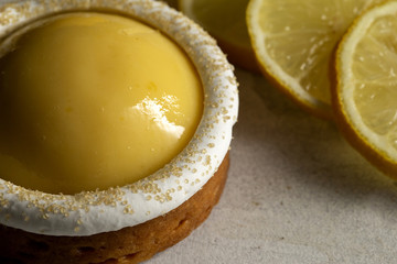 Lemon meringue tart with slices of fresh lemon