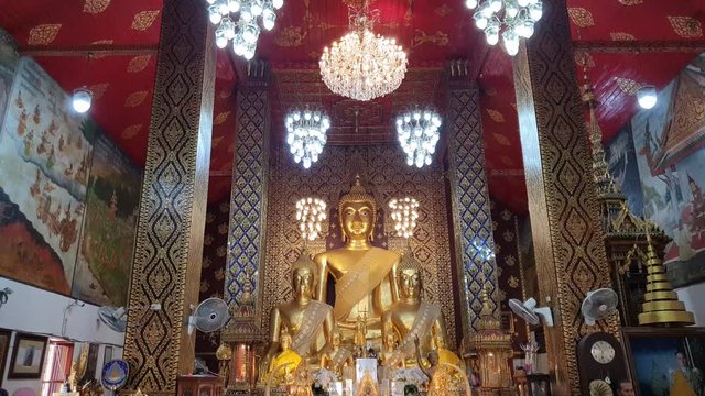 Beautiful golden Buddha statues at wat phra that hariphunchai popular public temple at Lamphun Province in the north of Thailand.