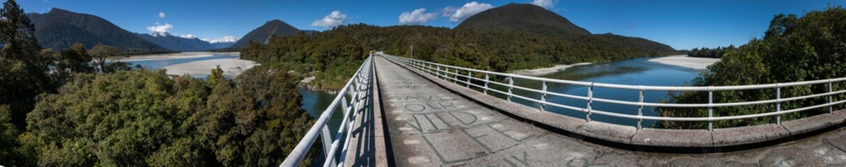 Road to Jackson bay. Westcoast New Zealand. Bridge Okuru river. Panorama