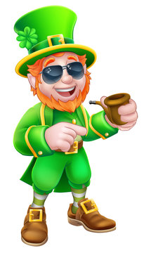 A Leprechaun St Patricks Day cartoon character mascot wearing cool sunglasses, holding a pipe and pointing