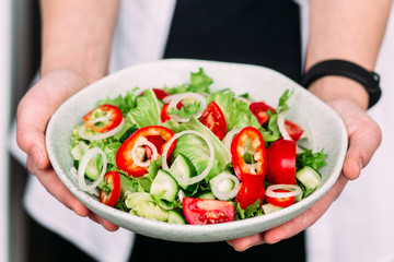 Vegetarian salad with tomatoes, cucumber and sweet pepper