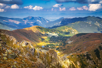 Mountainous landscape with hills and valleys at a sunny day in autumn season. The Low Tatras National Park in Slovakia, Europe.