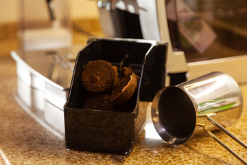 Container for grounds after coffee machine and cup of coffee