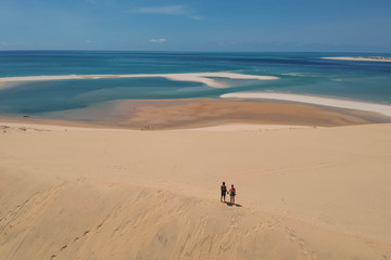 Ocean and Beach Panorama with Couple in Foreground 