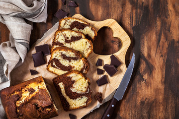 Delicious homemade marble pound cake  on wooden background, top view