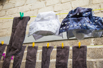 Eco-friendly baby cloth diapers hanging outside to dry