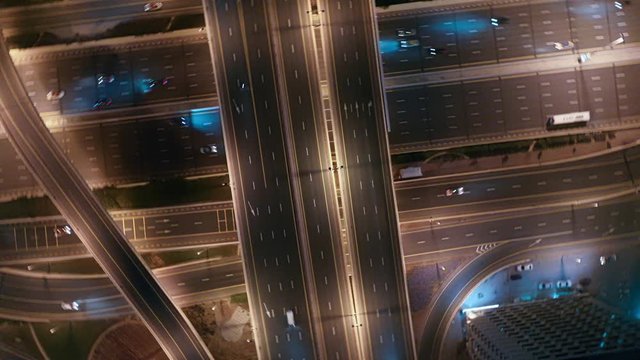 aerial top view of busy traffic on highway in Dubai at night