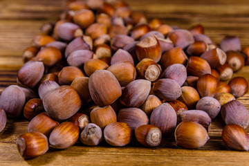 Pile of the hazelnuts on wooden table