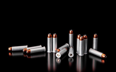 Bullet isolated on black background with reflexion. Rifle bullets close-up on black back....