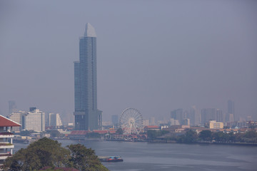 Bangkok office buildings and condominium with Chao Phraya river and chips. Office building under...