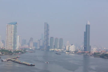 Bangkok office buildings and condominium with Chao Phraya river and chips. Office building under...