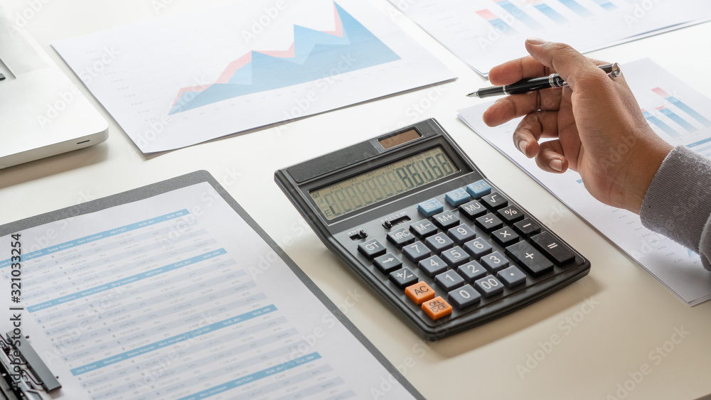 Aufkleber businessman working calculate data document graph chart report marketing research development planni