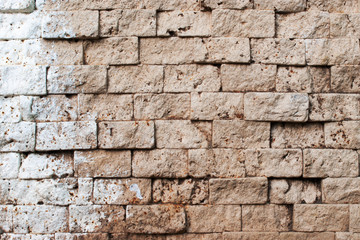 Old rough brown brick wall