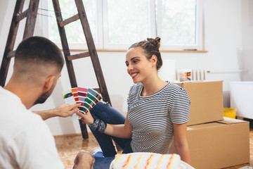 romantic couple decorating their new home