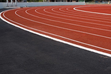 White lines of stadium and texture of running racetrack red rubber racetracks