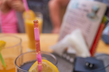 Straw with cola and menu