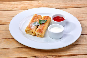 pancakes with sour cream and berry sauce