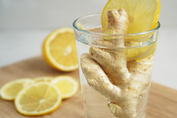 Water with lemon and ginger root. A warming winter drink.